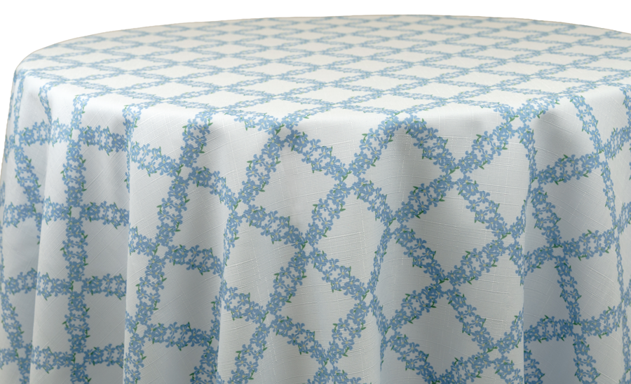 White tablecloth with a light blue forget-me-not lattice pattern
