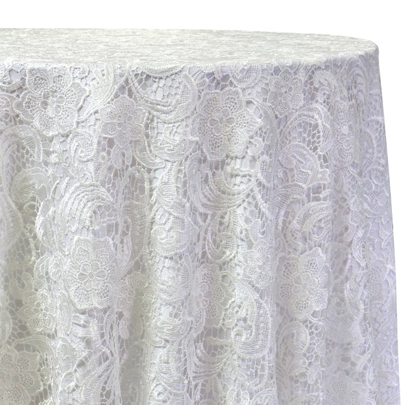 White floral lace tablecloth draped over a round table