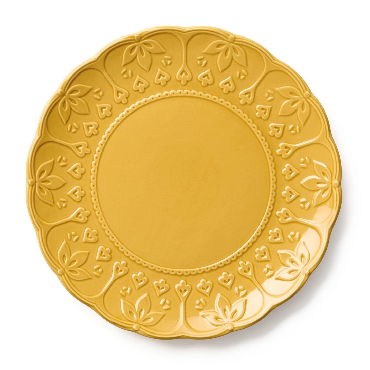 Mustard yellow charger plate with an embossed floral rim