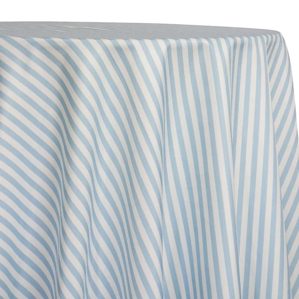 Powder blue and white striped tablecloth draped over a round table