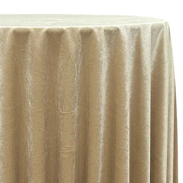 Champagne velvet tablecloth draped over a round table
