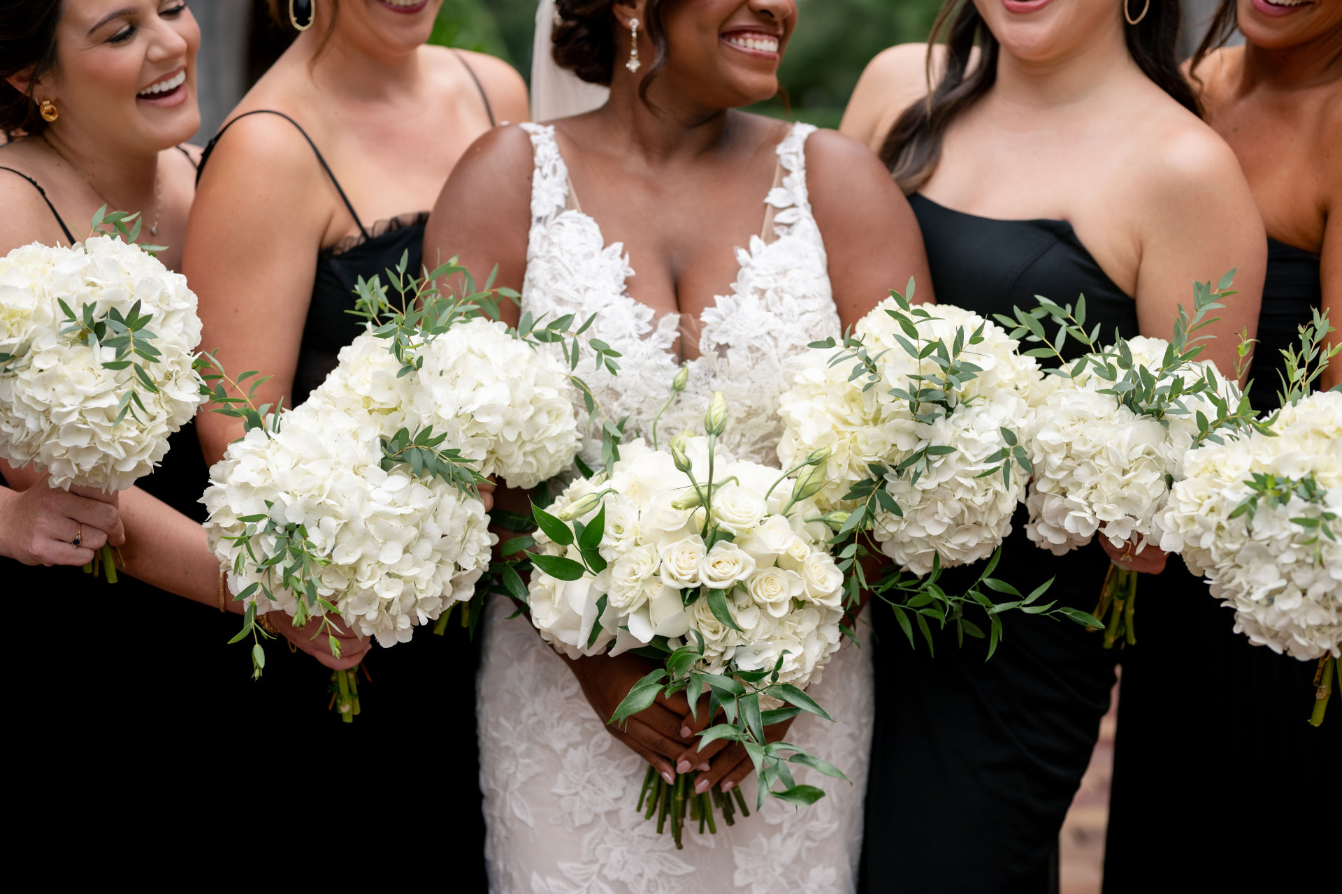 White hydrangea and rose bridal bouquets with greenery
